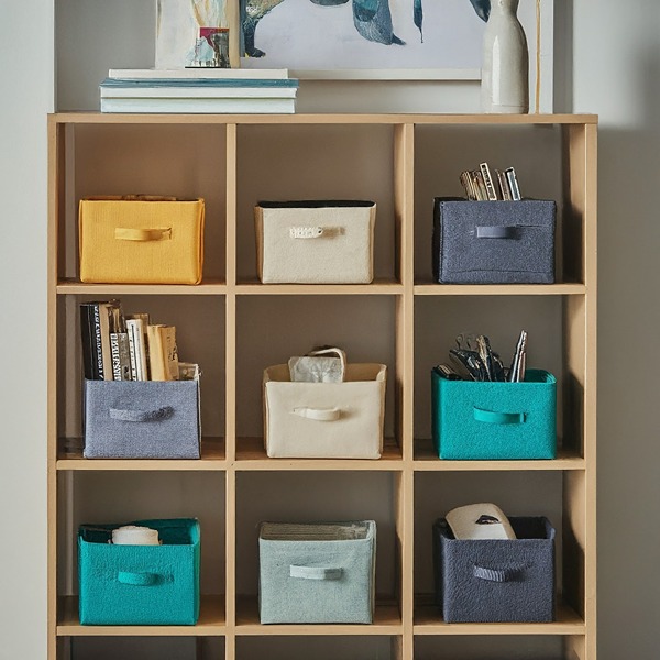 Colorful fabric storage cubes on shelf in dorm room