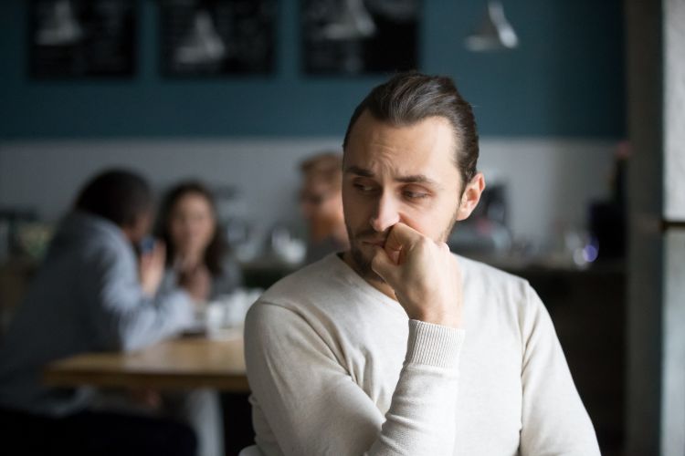 Introvert college student sitting alone