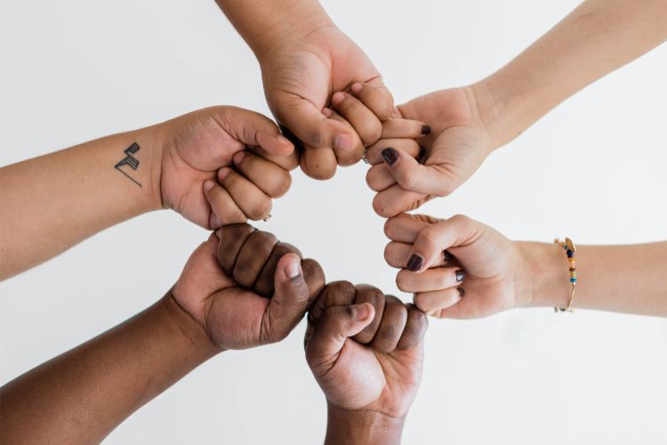 Children holding hands, building a supportive community against bullying