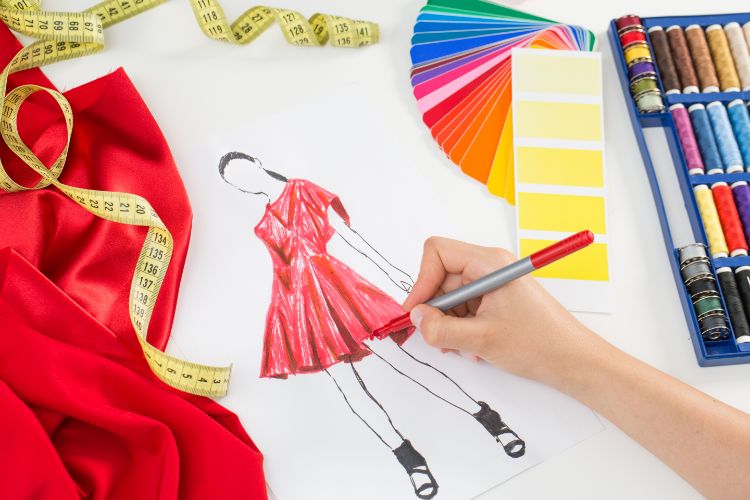 Fashion designer sketching a dress design.