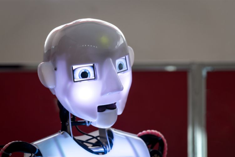 Humanoid robot face with glowing eyes for AI ethics course